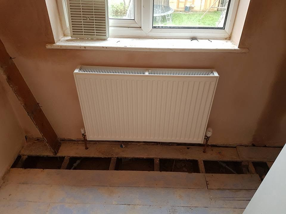 New central heating radiator fitted with thermostatic valve