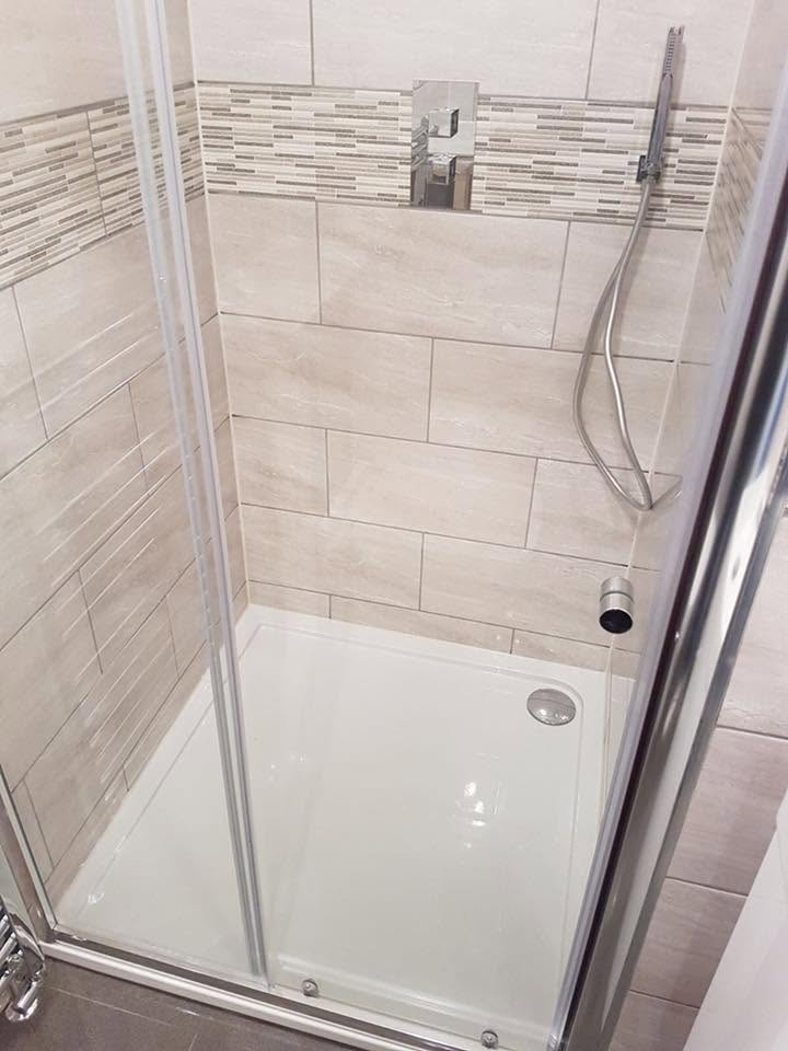 Newly tiled shower enclosure with chrome thermostatic shower fitted